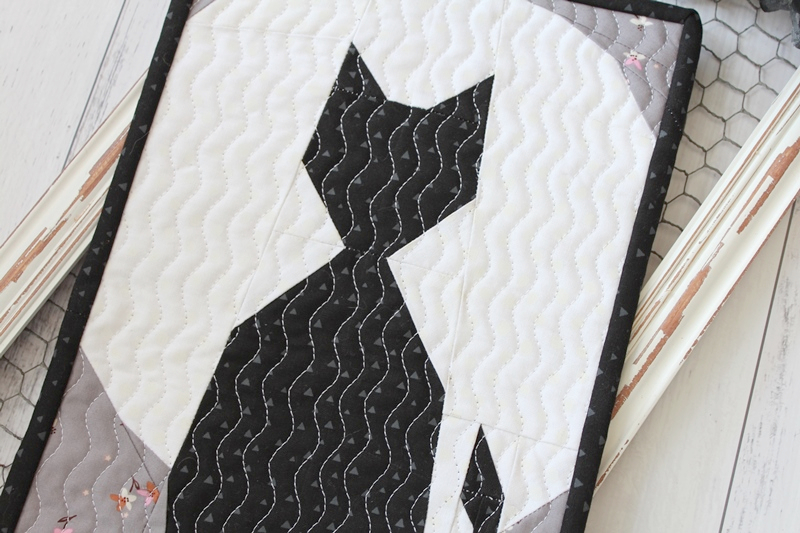 Salem foundation paper pieced mini quilt with a black cat in front of a full moon