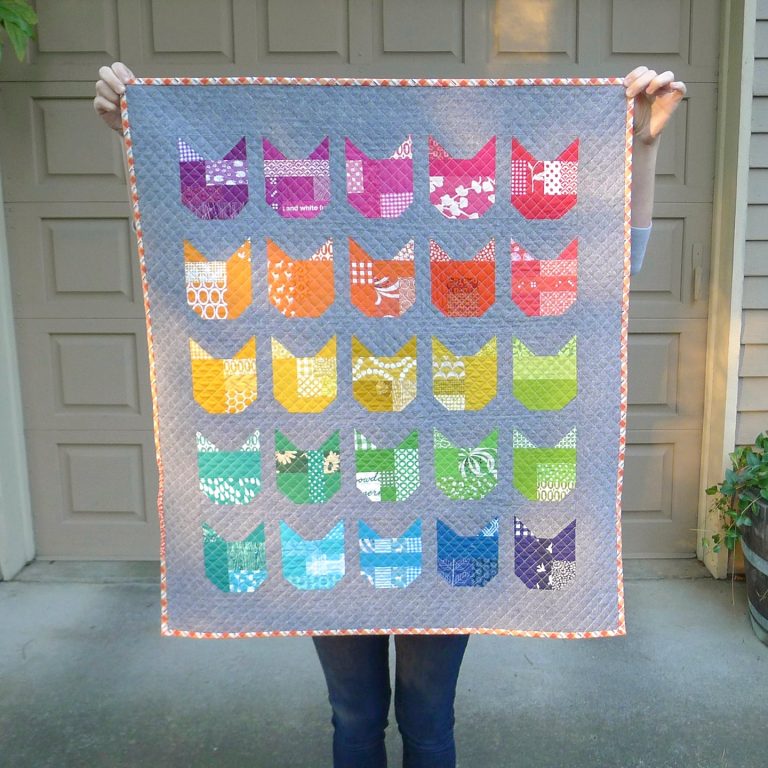 The Cat quilt by Elizabeth Hartman, a rainbow sampler of 25 patchwork cat faces